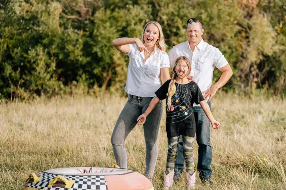A family laughing together at the ranch