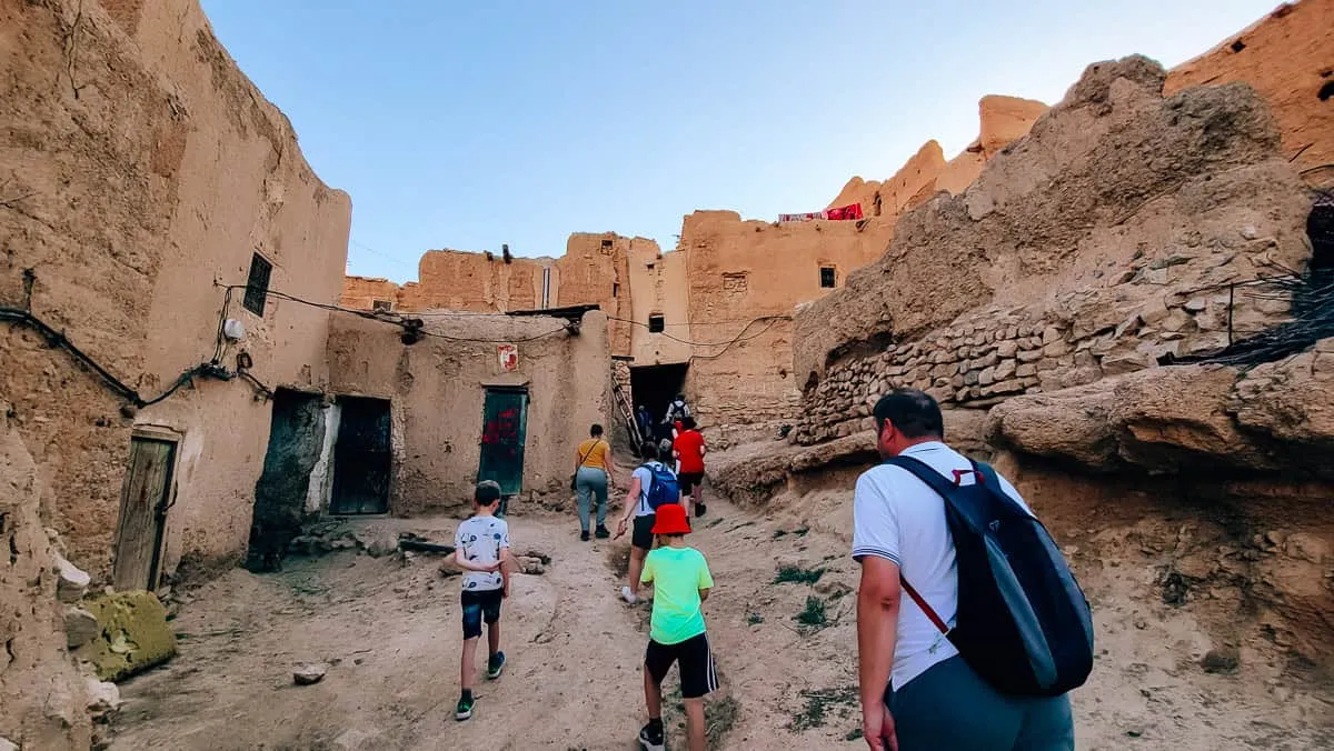 Kids exploring an old village in Morocco with their families